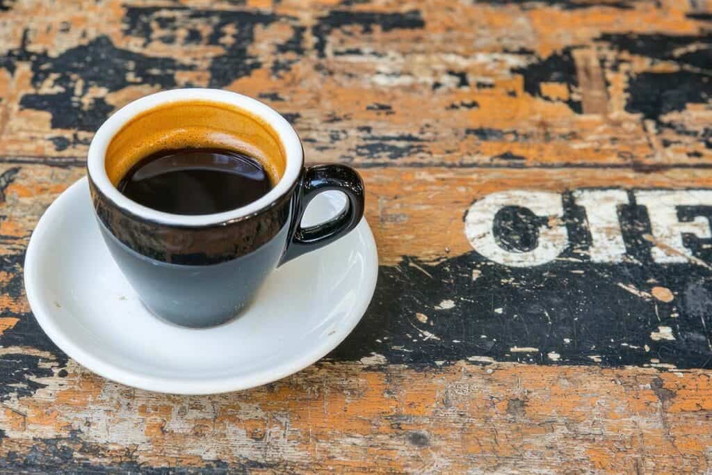 Espresso on Rustic Wooden Table Enjoy a Moment of Calm with Rich Coffee